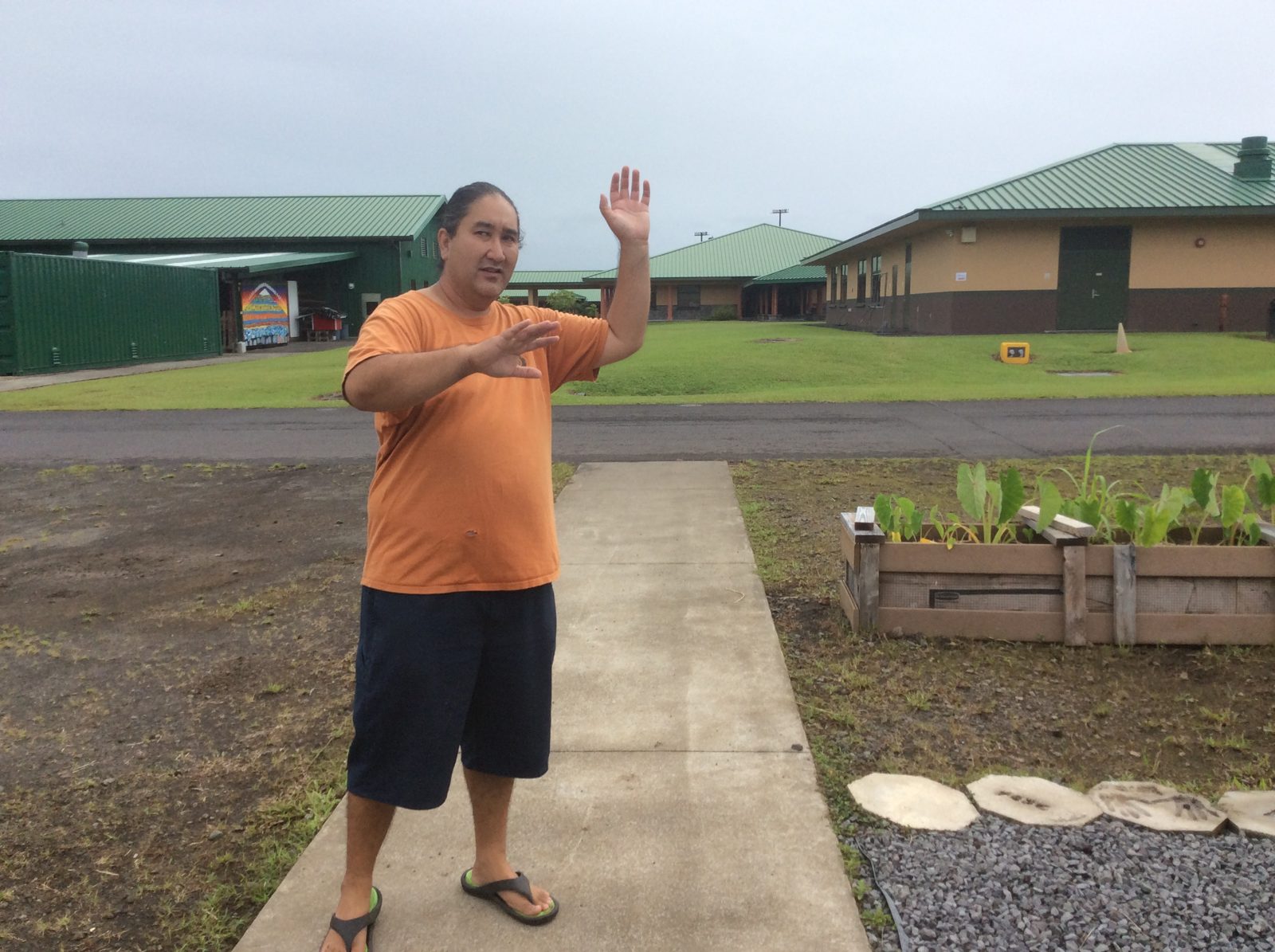 Saturday's farm tour at the Kalanianaʻole school garden, by its Kanāhoahoa sign.